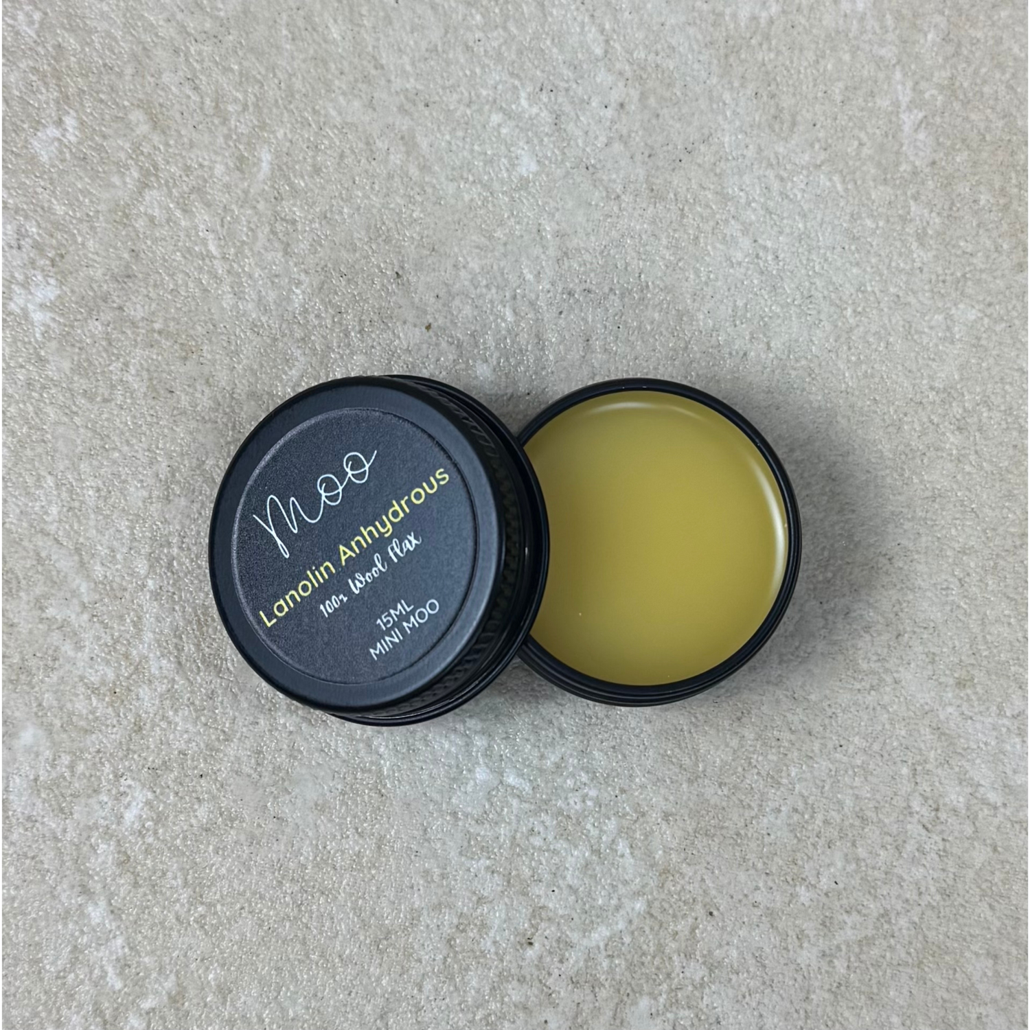 Lanolin anhydrous, a pure, water-free form of lanolin used in skincare formulations to deeply moisturize, protect, and nourish dry or sensitive skin naturally