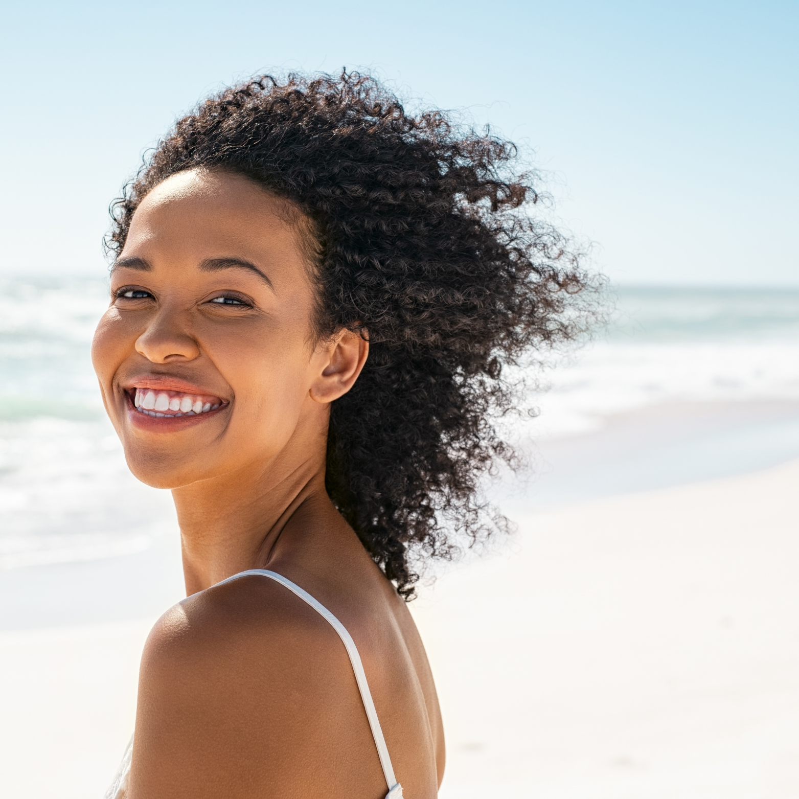 MOO Girl Beach Clear Skin image featuring a model with healthy, glowing skin on the beach, representing the nourishing effects of grass-fed beef tallow skincare products