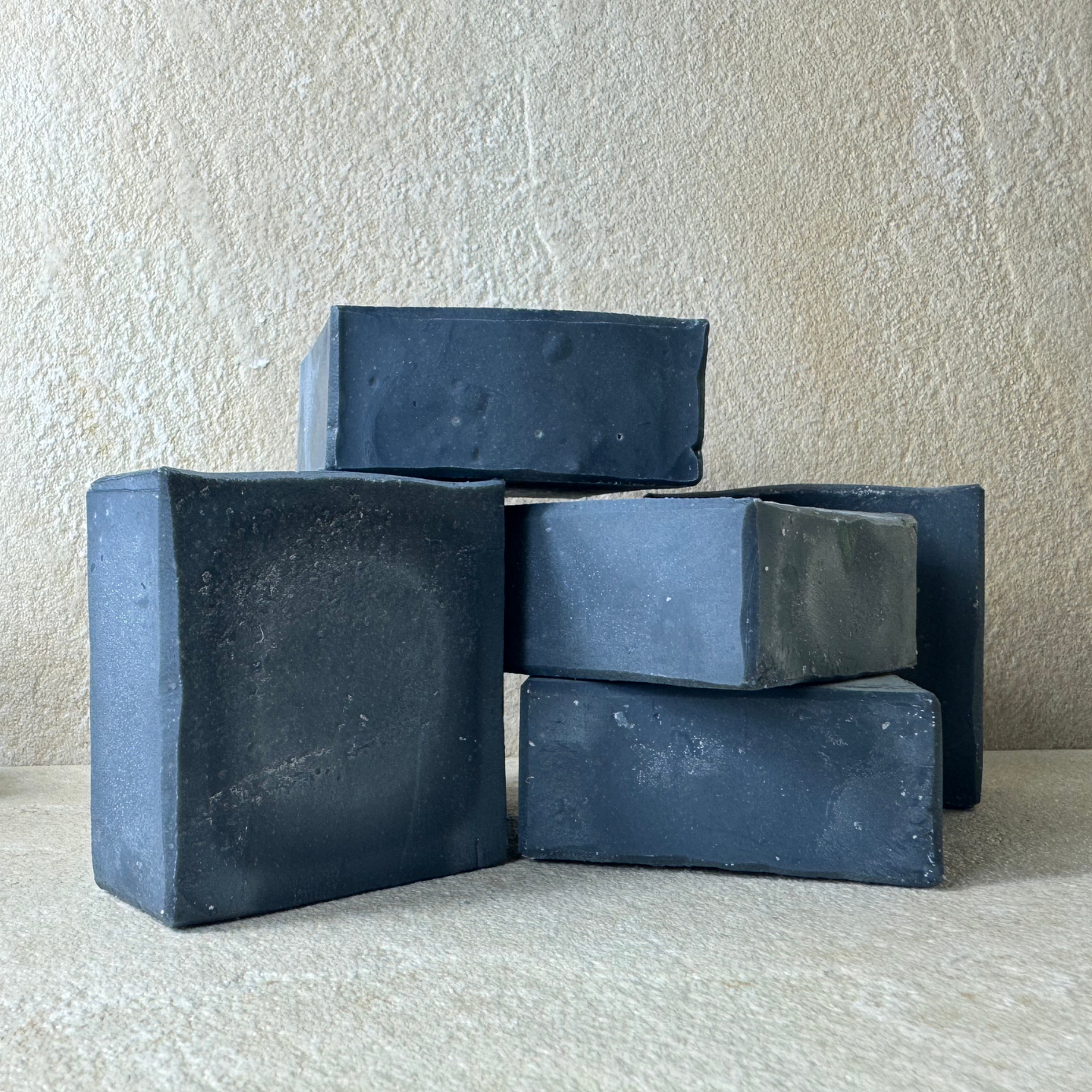 Tallow and charcoal soap without label, made with grass-fed beef tallow and activated charcoal to gently cleanse, detoxify, and nourish the skin naturally